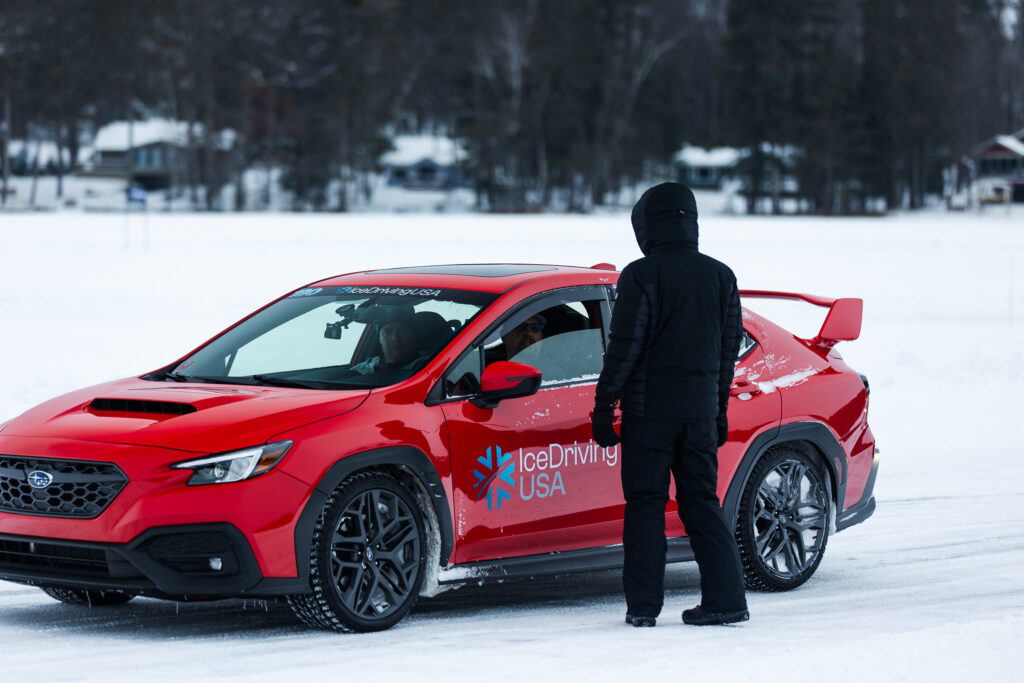 Ice driving car lineup on lake